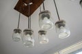 DIY Lamb design with glass jar and LED light bulb hanging from a