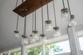 DIY Lamb design with glass jar and LED light bulb hanging from a