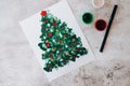 Paint with fingers Merry Christmas tree. Step by step. Happy New Year xmas tree decoration DIY Making greeting card