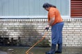 Man powerwashing mold of wall - DIY