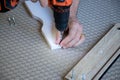 DIY moment detail indoors. Person following the steps to build a mdf wooden structure. Close-up image Royalty Free Stock Photo