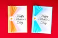 Diy Mothers Day greeting card in the form of curtain with paper chamomile flower on red background Royalty Free Stock Photo