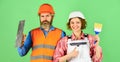 DIY repair. Construction workers. Home renovation. Cheerful couple renovating house. Woman builder hard hat. Man Royalty Free Stock Photo