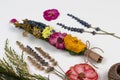 DIY smudge stick to banish bad energy. Dried herbs and flowers are tied into a bundle with a thread. Homemade incense