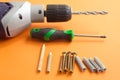 DIY tool set consisting of screws, dowels, screwdriver and drill