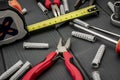 DIY tool set. Nylon plugs, pliers and flexometer with screwdrivers Royalty Free Stock Photo