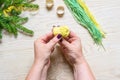 DIY winter craft, small beanie. Step 6: Twist the threads and thread them into the ring