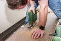 DIY worker cutting wooden panel with jig saw Royalty Free Stock Photo