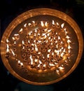 108 diya burning on the big golden plate in maha sandhi puja of goddess durga