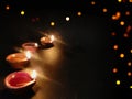 Diya or deep burning arranged in row on black background with Space for text ,Happy diwali wallpaper Royalty Free Stock Photo