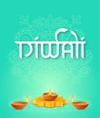 Diya oil lamp on podium and two lamp near on turquoise background with rangoli and text lettering Diwali in Hindi style