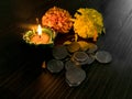 Diya placed on table with flowers to celebrate diwali and dhanteras Royalty Free Stock Photo