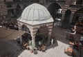 Aerial view inside the Hasan Pasha Inn, local people drinks traditional tea and coffee