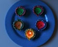 5 Lit diyas arranged to celebrate diwali and dhanteras