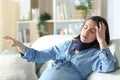 Dizzy disabled pregnant woman with neck brace at home Royalty Free Stock Photo