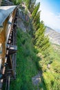 Dizzying look to mountain rocky profile with steep slope down to the canyon