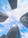 Dizzying low-angle view of skyscrapers under sky with the Shinjuku\'s iconic buildings in Japan.