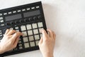 a dj audio producer fingers play the drum music on pads of drum machine Royalty Free Stock Photo