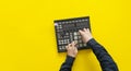 a dj audio producer fingers play the drum music on pads of drum machine