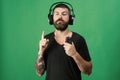 Dj with beard wears headphones, copy space. Music and leisure Royalty Free Stock Photo