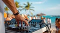 DJ booth on a tropical beach, surrounded by dancing partygoers Royalty Free Stock Photo