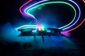 Dj club concept. Creative artwork decoration of dj table on dark toned background with lights and fog