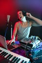 Dj with colorful light and music mixing equipment Royalty Free Stock Photo