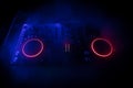 DJ console deejay-mixing desk in dark with colorful light. Mixer equipment entertainment DJ station Royalty Free Stock Photo