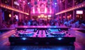 DJ console mixer in booth on table in nightclub at night party against background of people dancing Royalty Free Stock Photo