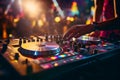 dj control on a mixer table in a disco club, colorful bokeh background Royalty Free Stock Photo