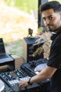 DJ doing playback at a party to take a break from the mixing desk