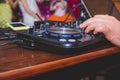 DJ Hands creating and regulating music on dj console mixer in concert outdoor.DJ mixer controller panel for playing Royalty Free Stock Photo
