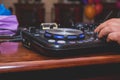 DJ Hands creating and regulating music on dj console mixer in concert outdoor.DJ mixer controller panel for playing Royalty Free Stock Photo