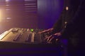 Dj hands by mixing music in a club