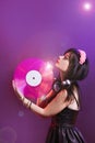 Dj headphone equipment disco girl party retro vintage ultraviolet mixer young woman vinyl glamor valentine`s day plastic pink Royalty Free Stock Photo
