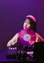 Dj headphone equipment disco girl party retro vintage ultraviolet mixer young woman vinyl glamor valentine`s day plastic pink Royalty Free Stock Photo