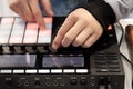 DJ mix and plays music using MIDI controller Royalty Free Stock Photo