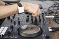 Dj mixing music outdoor at beach party festival - Close up of sound mixer equipment - Focus on hand - Fun, millennials generation Royalty Free Stock Photo