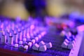 DJ music control panel in purple rays