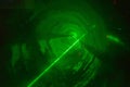 Dj party laser show, green laser in smoke Royalty Free Stock Photo