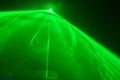 Dj party laser show, green laser in smoke Royalty Free Stock Photo