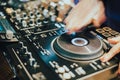 Dj playing disco house progressive electro music at the concert. DJ hands on equipment Royalty Free Stock Photo