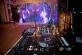 Dj playing disco house progressive electro music at the concert. DJ hands on equipment . DJ plays mix on controller at a disco in Royalty Free Stock Photo