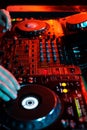 DJ playing music in night club party. Turntable equipment in dar Royalty Free Stock Photo