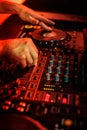 DJ playing music in night club party. Turntable equipment in dar Royalty Free Stock Photo