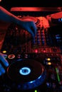 DJ playing music in night club party. Turntable equipment in dar Royalty Free Stock Photo