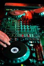 DJ playing music in night club party. Turntable equipment in dar Royalty Free Stock Photo