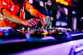 DJ is playing music in a nightclub Royalty Free Stock Photo