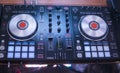 DJ plays and mix music on digital mixer controller. Close-up DJ performance controller, digital midi turntable system