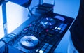 DJ plays and mix music on digital mixer controller. Close-up DJ performance controller, digital midi turntable system